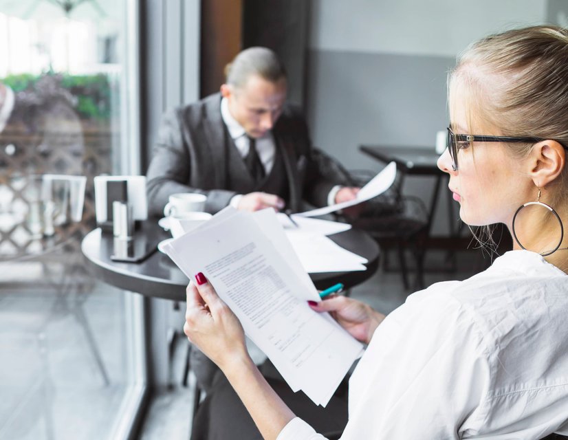 Lawyer reviewing case documents in office
